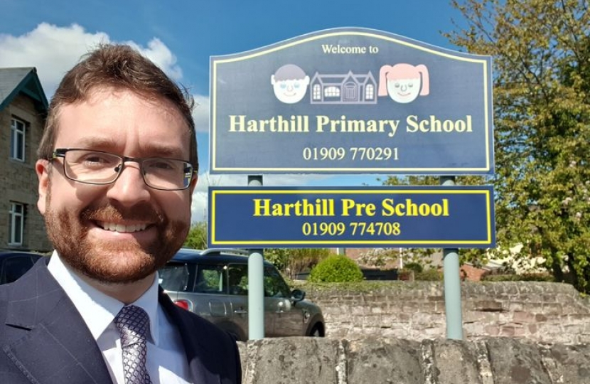 Alexander Stafford outside Harthill Primary School sign