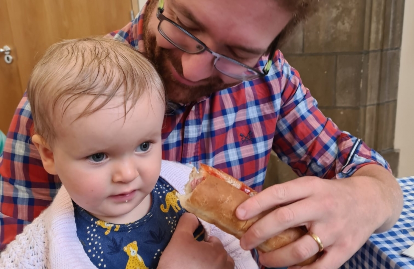 Alexander Stafford with baby daughter at fair