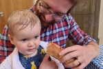 Alexander Stafford with baby daughter at fair